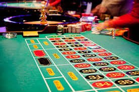 100jili Live Casino dealer streaming baccarat table to Filipino players